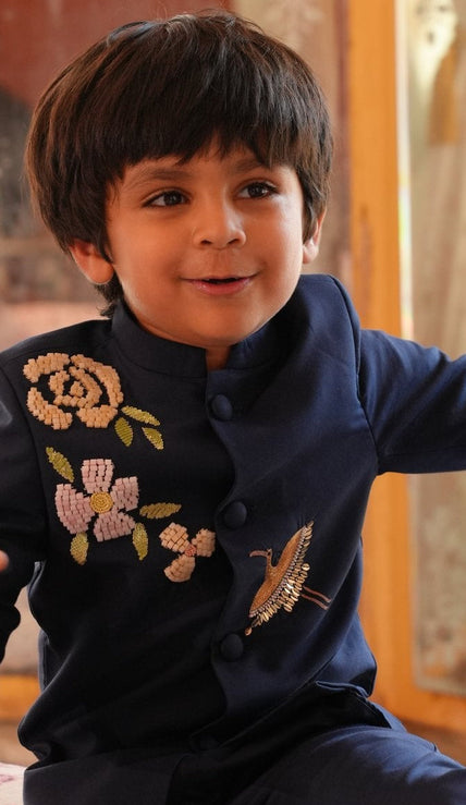 Boy wearing FunnyBones Navy Jodhpuri with Floral & Crane Embroidery – navy jodhpuri with bead rose and zari crane embroidery