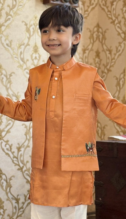 Boy wearing FunnyBones Orange Monkey Nehru Jacket – orange Nehru jacket with monkey and vine embroidery