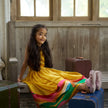 Indian girl wearing the Golden Savanna dress in Pure Satin Silk, Sunshine Yellow — FunnyBones.in Mehfil '26 festive collection.