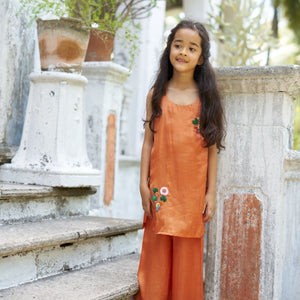 Indian girl wearing the Terra Bloom kurti palazzo set in Pure Soft Silk (Extra Soft), Warm Terracotta — FunnyBones.in Mehfil '26 festive collection.