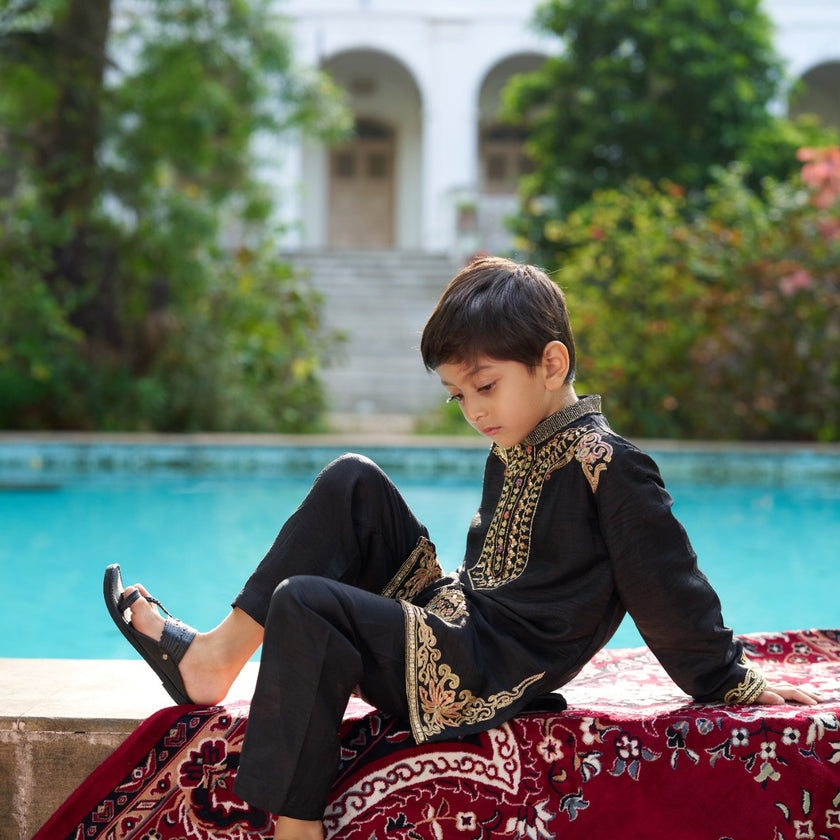 Indian boy wearing the Shahenshah kurta pajama set in Pure Soft Silk, Jet Black — FunnyBones.in Mehfil '26 festive collection.