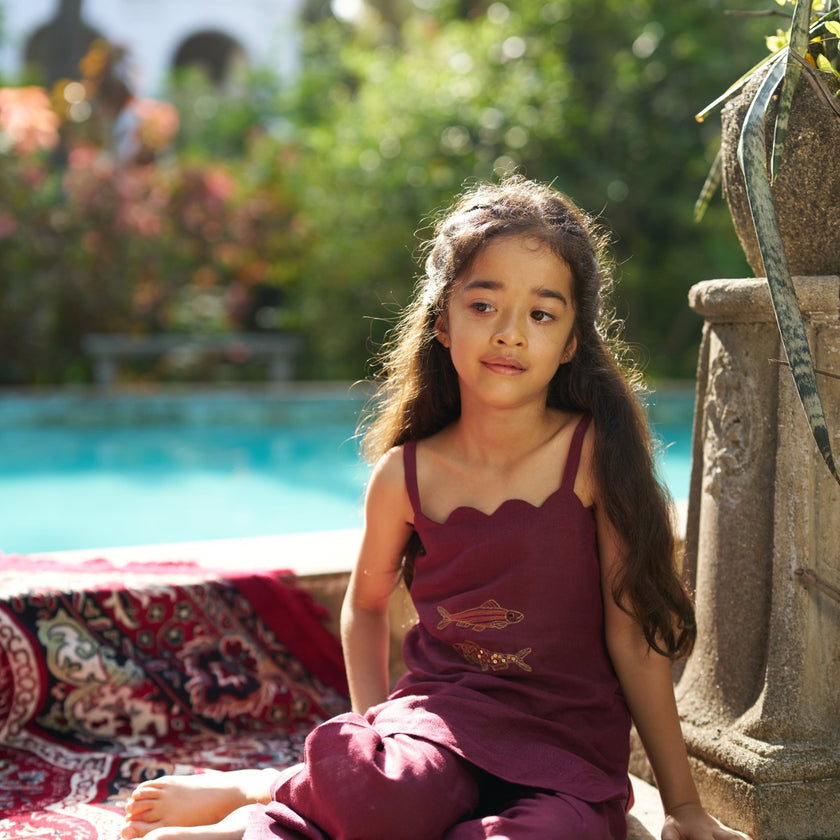 Indian girl wearing the Golden Koi kurti palazzo set in Pure Linen, Deep Wine — FunnyBones.in Mehfil '26 festive collection.