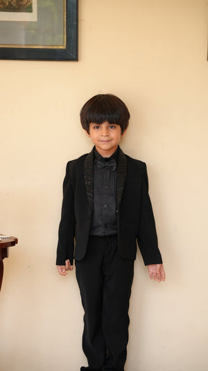 Boy wearing FunnyBones Black Blazer with Sequin Shawl Lapel – black tuxedo blazer for kids weddings
