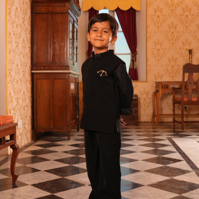 Boy wearing FunnyBones Black Nehru Jacket with Bow & Arrow – black bandhgala with gold bow and arrow embroidery