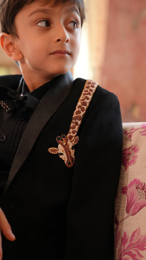 Boy wearing FunnyBones Black Tuxedo with Beaded Giraffe – black tuxedo blazer with hand-beaded giraffe on the lapel