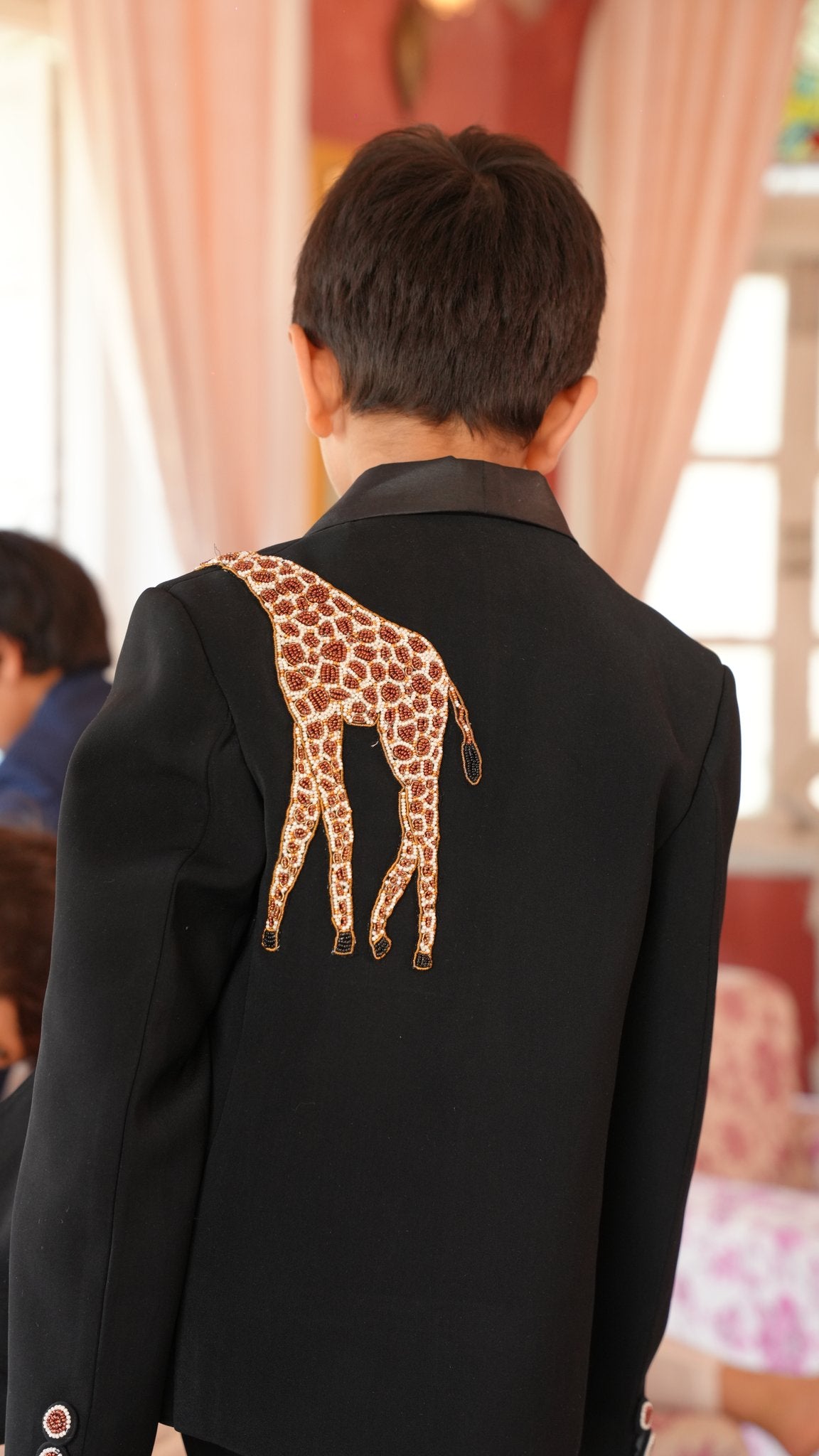 FunnyBones Black Tuxedo with Beaded Giraffe – back view with beaded giraffe