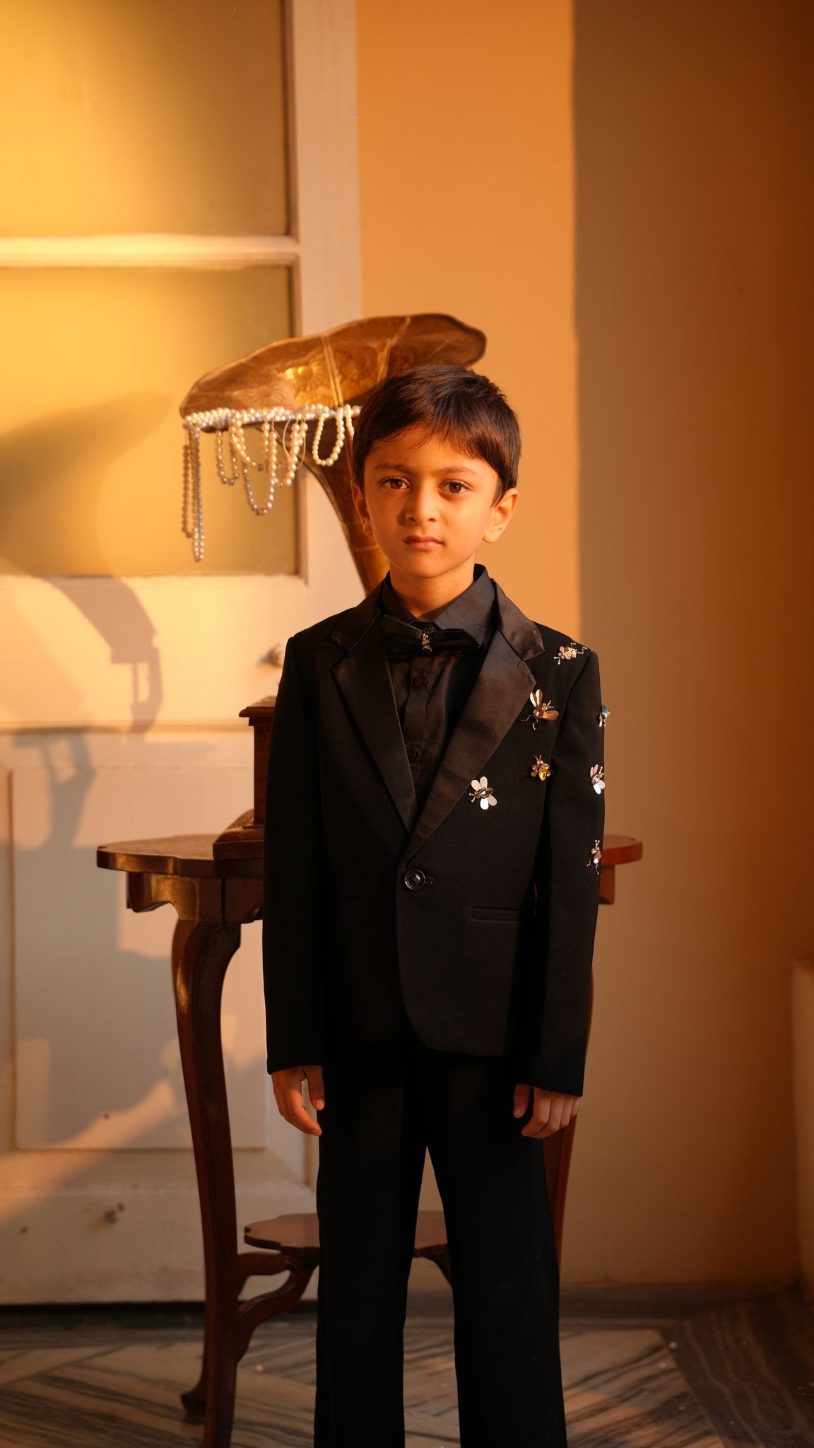 Boy wearing FunnyBones Black Tuxedo Set with Butterfly Bee Handworked – black tuxedo for kids weddings