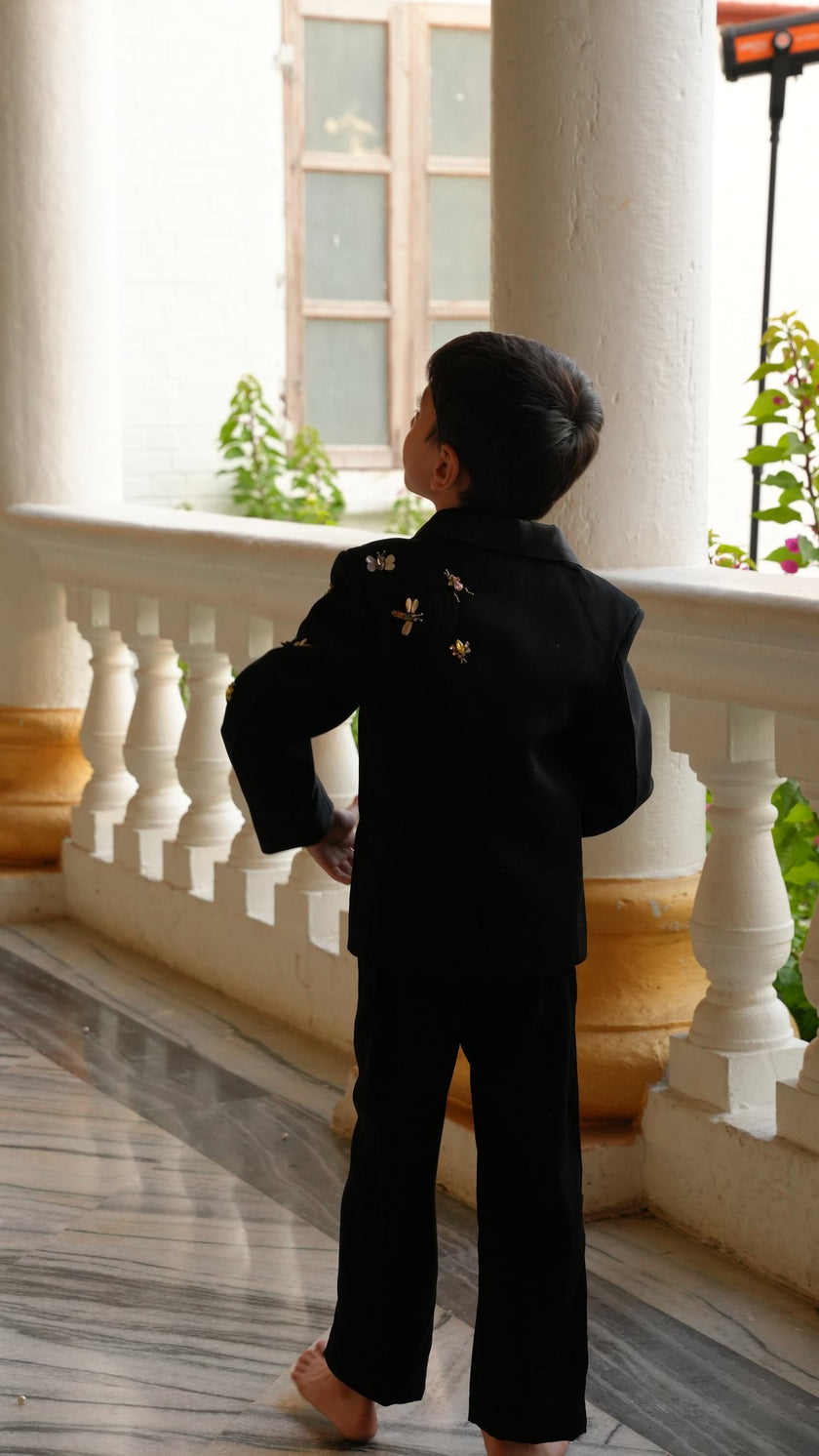 FunnyBones Black Tuxedo with Butterfly Bee – back view on a balcony