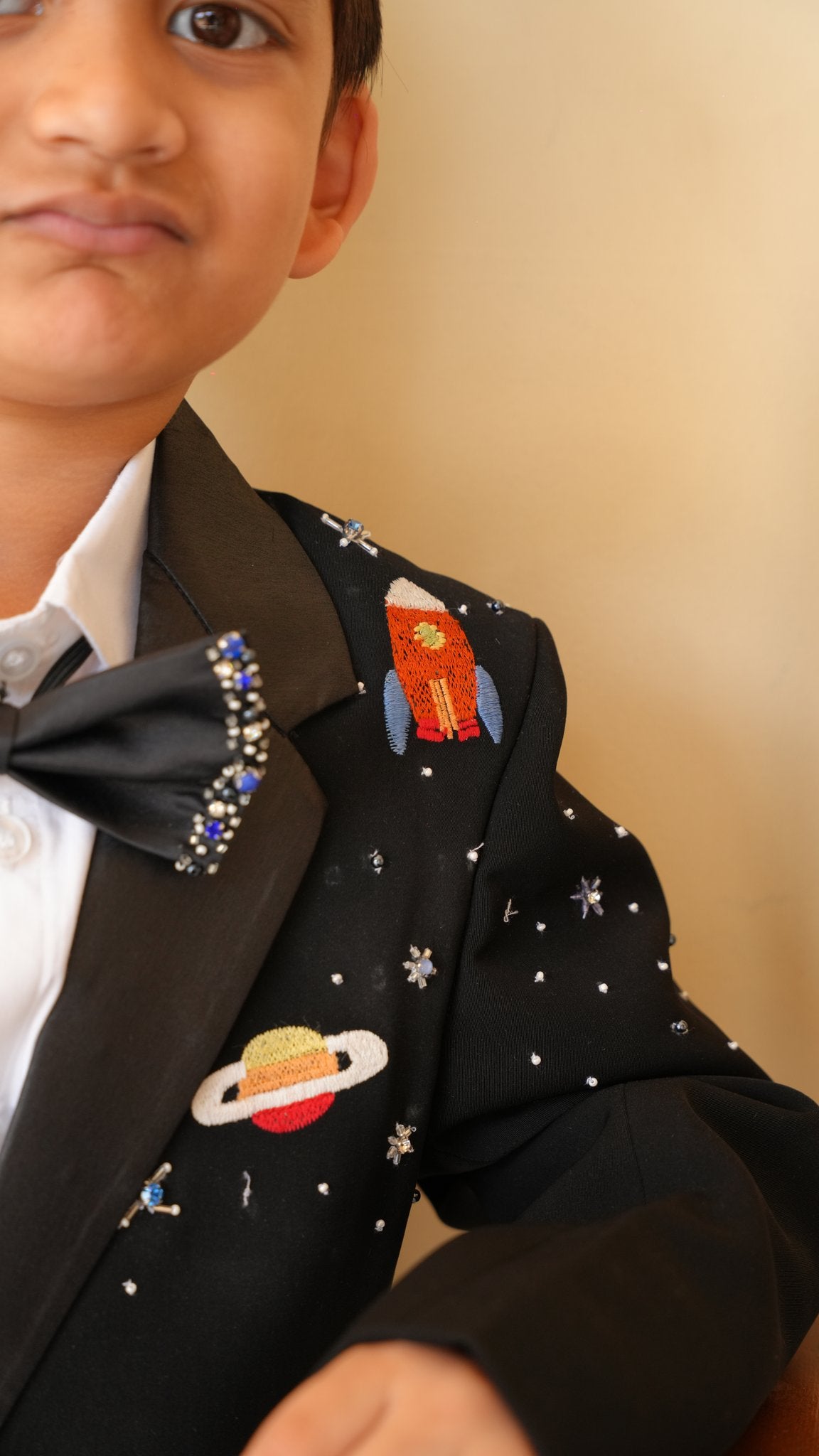 FunnyBones Black Tuxedo with Galaxy Embroidery – close-up of planet and rocket embroidery