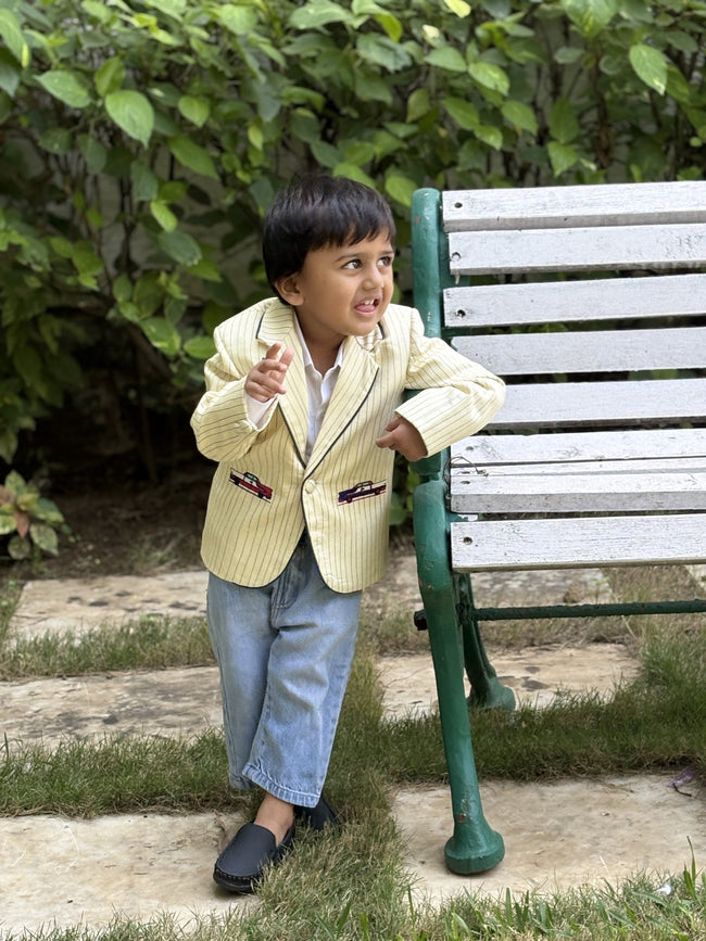 Boy wearing FunnyBones Butter Pinstripe Blazer with Car Patches – butter yellow pinstripe blazer with car patches