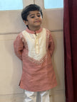 Boy wearing FunnyBones Coral Kurta with Mirror-Work Yoke – coral linen kurta with ivory mirror-work yoke