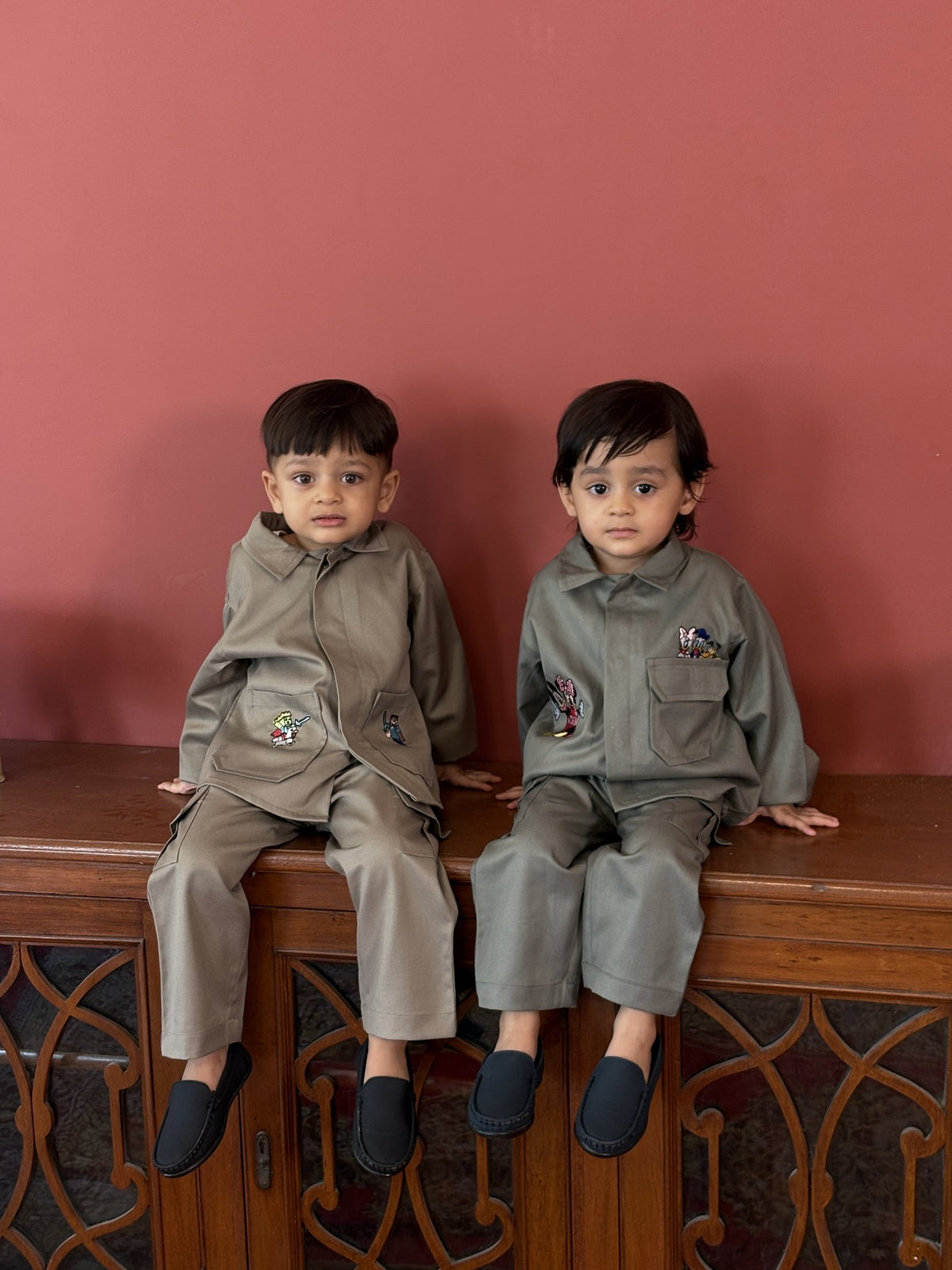 Boy wearing FunnyBones Disney Themed Baggy Shacket & Cargo Set – olive baggy shacket and cargo set with cartoon patches