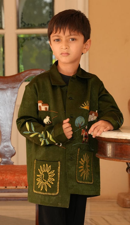 Boy wearing FunnyBones Farm & Paradise Appliqué Jacket – olive suede-look jacket with farm scene applique