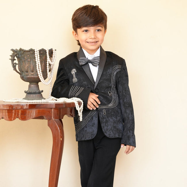 Boy wearing FunnyBones Grey Blazer with Music-Note Embroidery – charcoal shawl-lapel blazer with bow tie