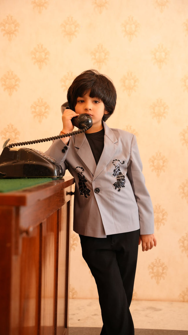 Boy wearing FunnyBones Grey Blazer with Tiger Embroidery – light grey blazer with black tiger embroidery