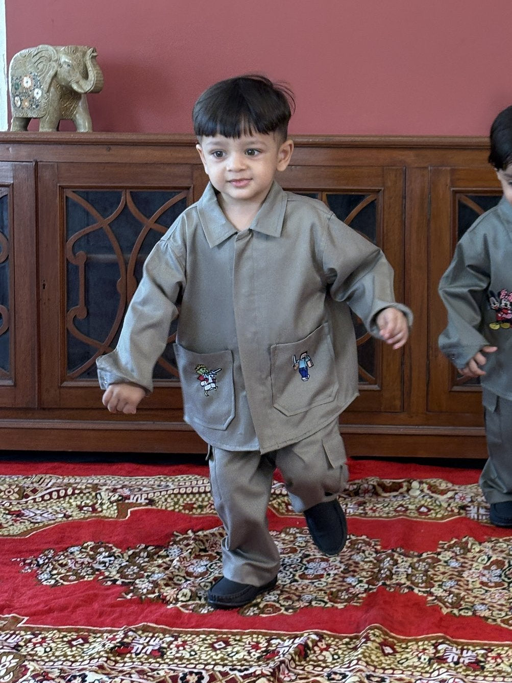Boy wearing FunnyBones Minecraft Themed Baggy Shacket & Cargo Set – olive baggy shacket and cargo set with pixel-game patches