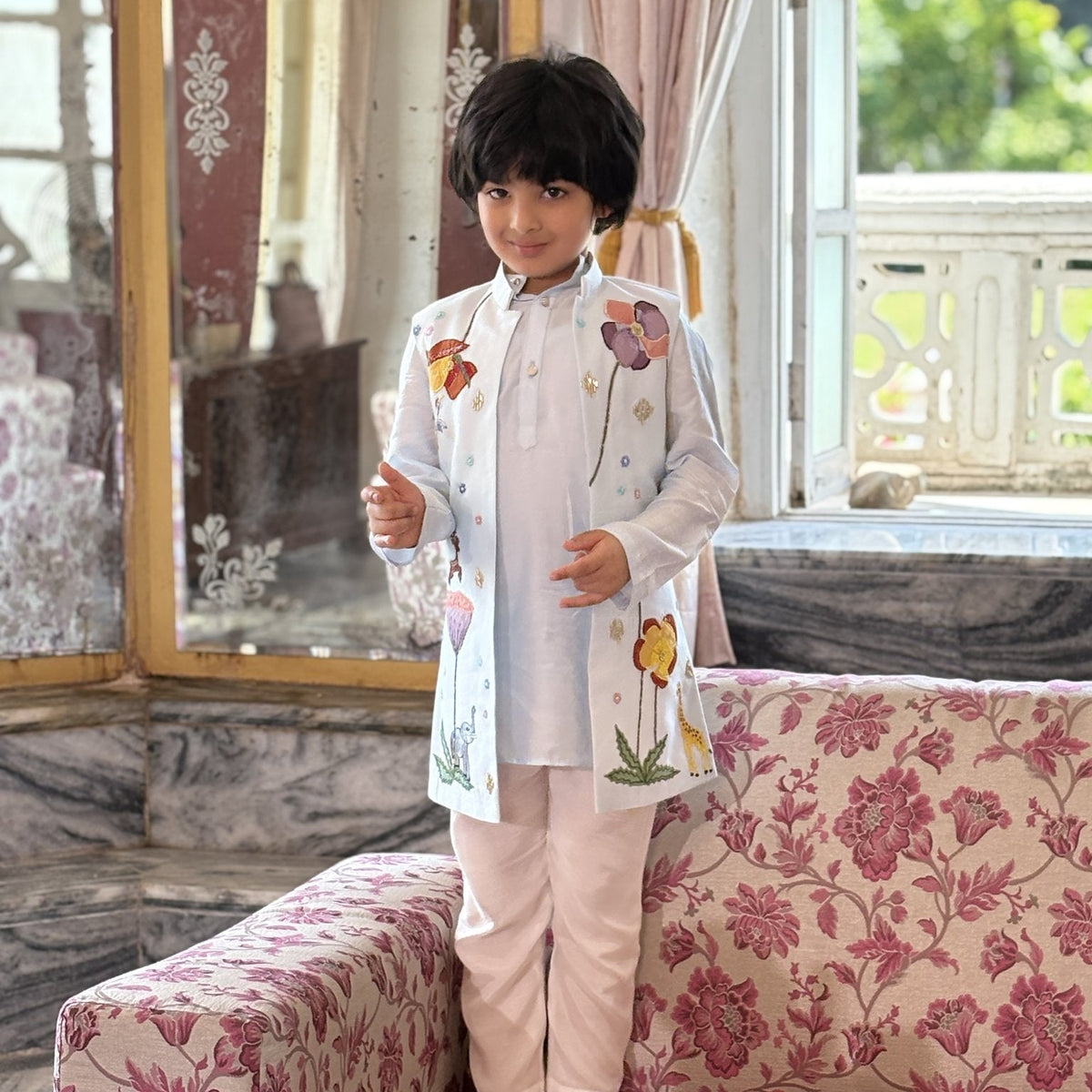 Boy wearing FunnyBones Mint Embroidered Achkan – pastel long koti with floral and animal embroidery