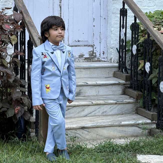 Boy wearing FunnyBones Powder Blue Blazer with Cartoon Patches – powder blue blazer suit with cartoon patches
