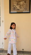 Boy wearing FunnyBones Seaside Patchwork Print Blazer – pastel seaside print linen blazer with white pants