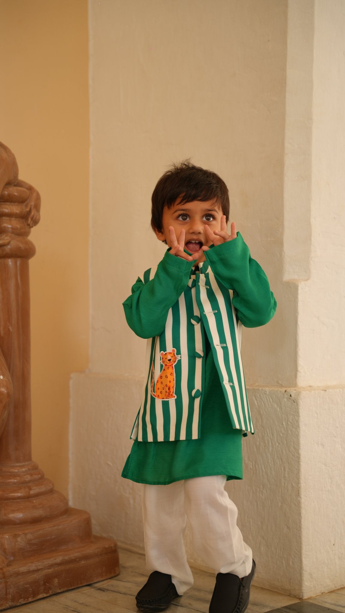 Boy wearing FunnyBones Striped Leopard Nehru Jacket & Green Kurta – green and white striped jacket with leopard applique and green kurta
