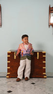 Boy wearing FunnyBones Sunset Storybook Blazer – ombré pink and lilac linen blazer with white pants