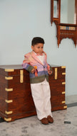FunnyBones Sunset Storybook Blazer – boy leaning on a vintage trunk