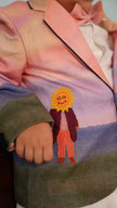 FunnyBones Sunset Storybook Blazer – close-up of sun-face appliqué figure