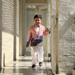 FunnyBones Sunset Storybook Blazer – boy walking down a sunlit corridor