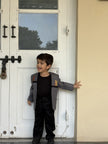 Boy wearing FunnyBones White Blazer with Animal Panels – grey panel blazer with giraffe embroidery and black tee